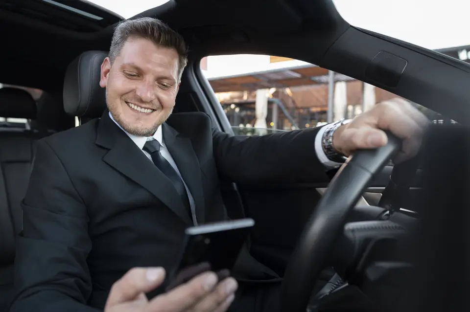 Smiling professional chauffeur